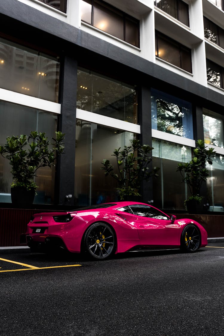 Pink Luxury Car Parked In The City Street 