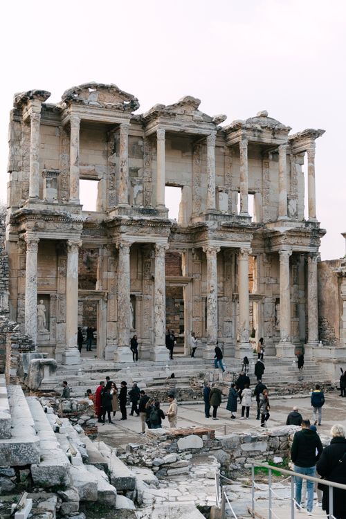 Free Explore the majestic ancient Roman ruins of Ephesus with visitors amidst historic architecture. Stock Photo