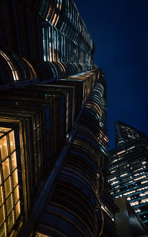Low-Angle Shot of High Rise Buildings in the City during Nighttime