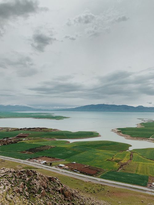 Free Beautiful aerial view of Lake Dukan with surrounding fields in Qurago, Sulaymaniyah, Iraq. Stock Photo