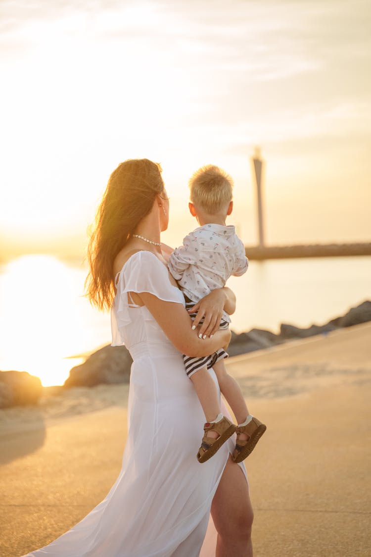 A Woman Holding Her Child