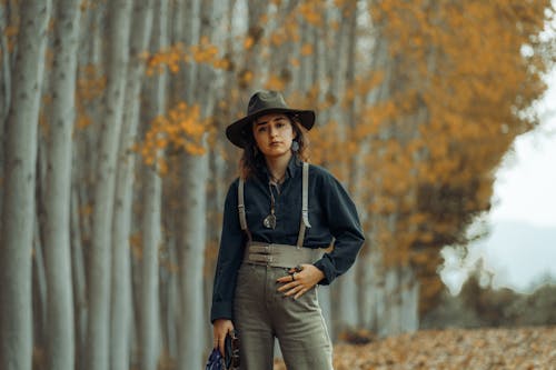 A Woman in Black Long Sleeves Wearing a Hat