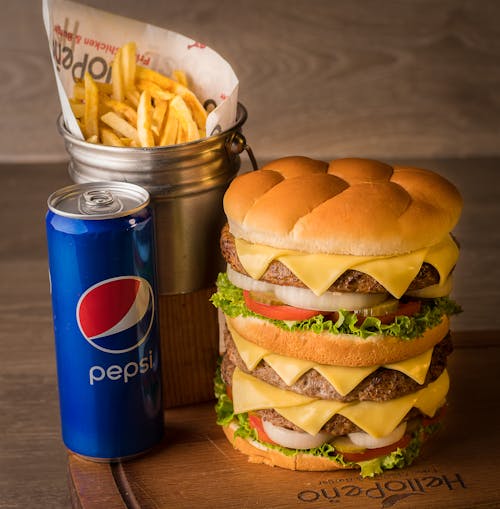 Burger and French Fries with a Can of Pepsi Cola 