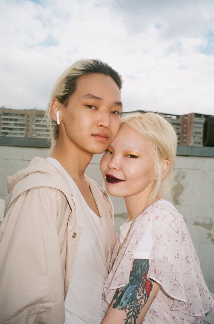 Young Couple Standing Together In City 