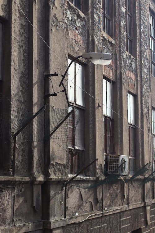 Streetlamp on a Wall of a Decaying Building