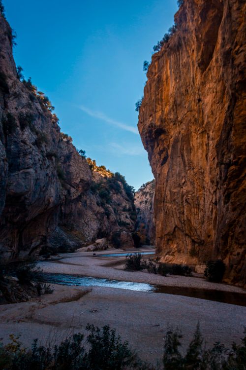 Stream Between Two Rocks Stream Flowing Between Two Rock Formations · Free Stock Photo