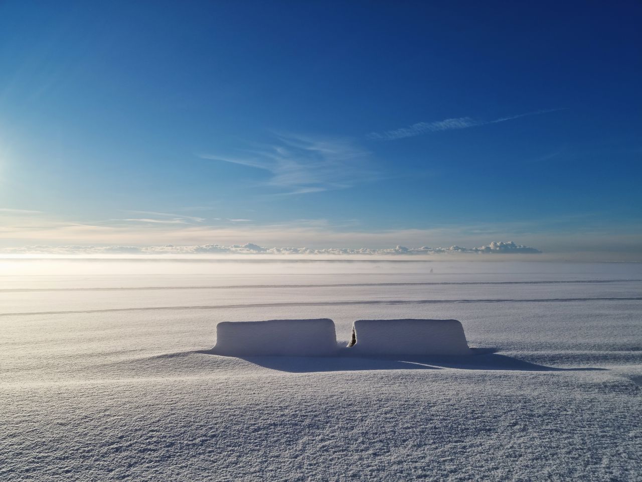 tranquil snow covered field under a bright blue sky in p rnu estonia c