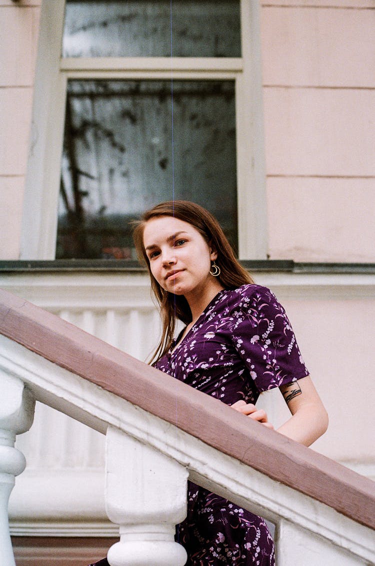 Young Woman Walking Up The Stairs 