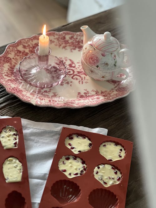 Wax Candle, Teapot and Sweet Chocolates