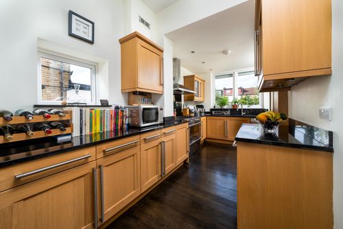 Free Bright modern kitchen interior with wooden cabinets and minimalist design. Stock Photo