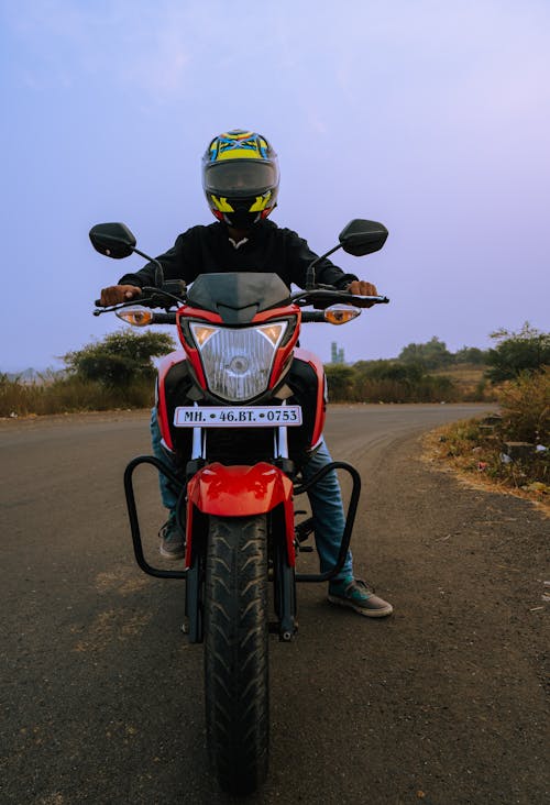 Photo of Person Riding a Motorcycle