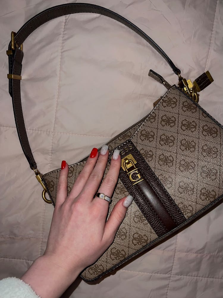 Womans Hand On A Handbag