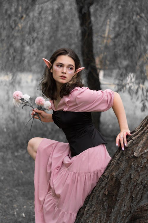 Free A Fairy with Long Ears Holding a Buch of Flowers Stock Photo