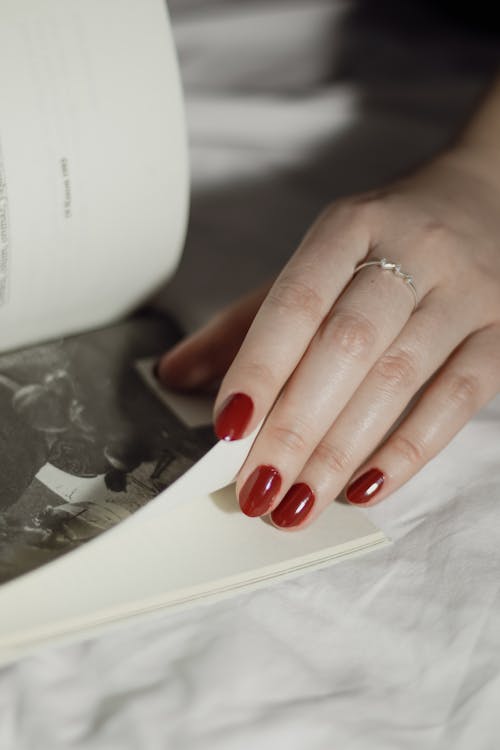 Close up of Woman Hand on Book Page