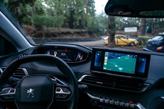 Sleek car interior showing advanced navigation system and dashboard details.