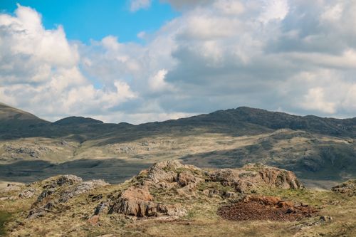 Free Breathtaking view of rocky mountains under a partly cloudy sky, perfect for nature enthusiasts. Stock Photo
