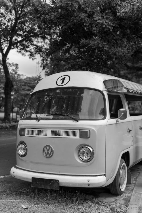 Free Classic Volkswagen van parked on a street in Yogyakarta, Indonesia. Black and white shot. Stock Photo