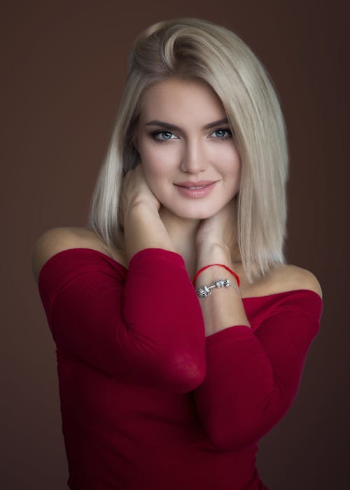 Studio Shot of a Young Blonde in a Red Blouse