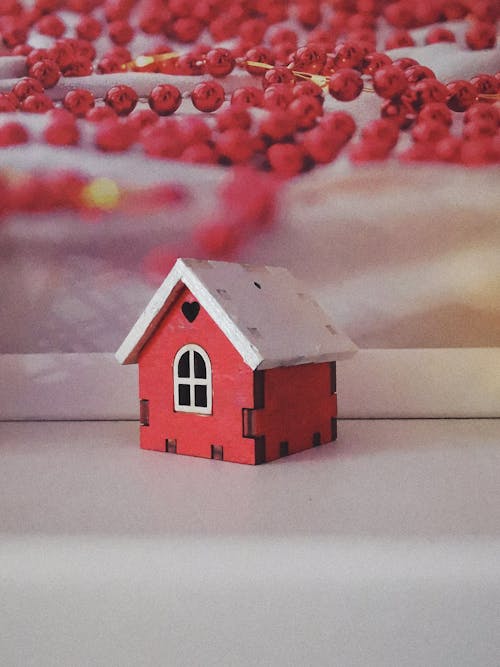 Close-up Photo of a Tiny Red House 
