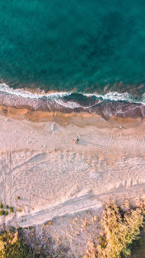 Free Stunning aerial shot of a beach in Chania, Greece with turquoise waters. Stock Photo