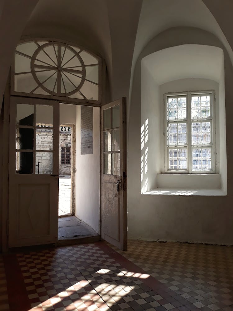 House Interior With Wooden Doors And Metal Framed Glass Window