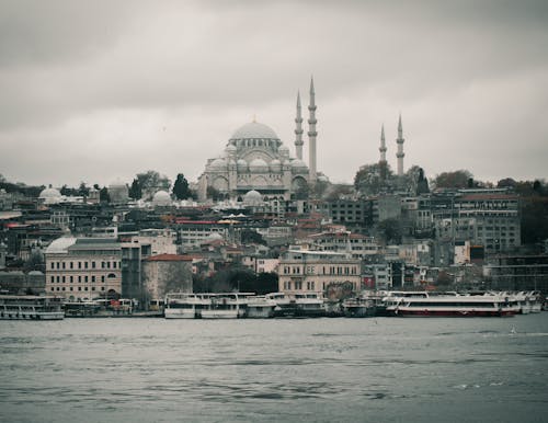 View of Boats on the Bosporus and Buildings in Istanbul with the Suleymaniye Mosque on a Hill