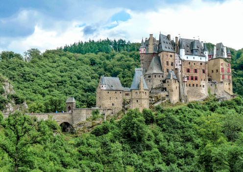 Stunning aerial view of the medieval Eltz Castle nestled in the lush landscapes of RP, Germany.