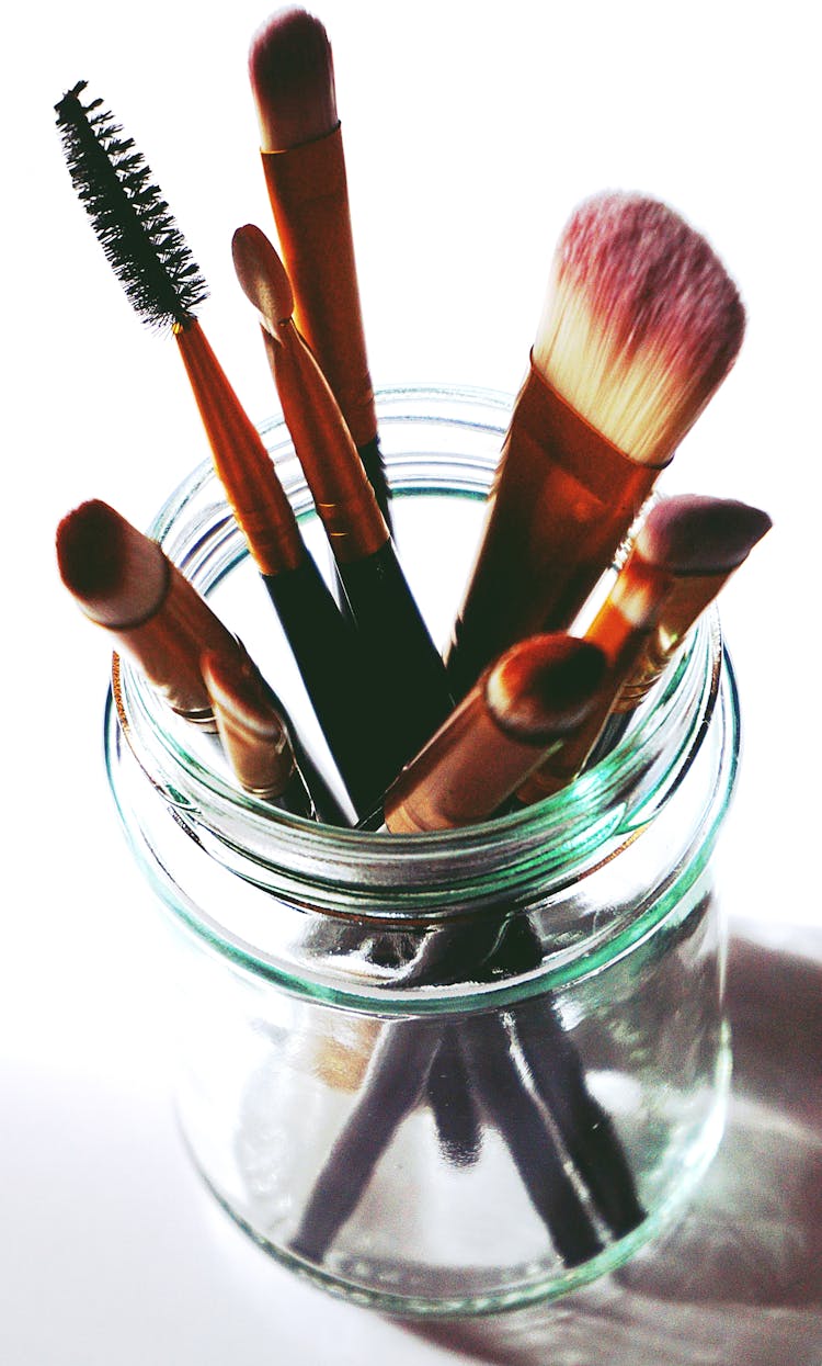 Brown Makeup Brushes In Clear Glass Mason Jar