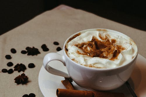 Free Hot Drink with Cream in Cup Stock Photo