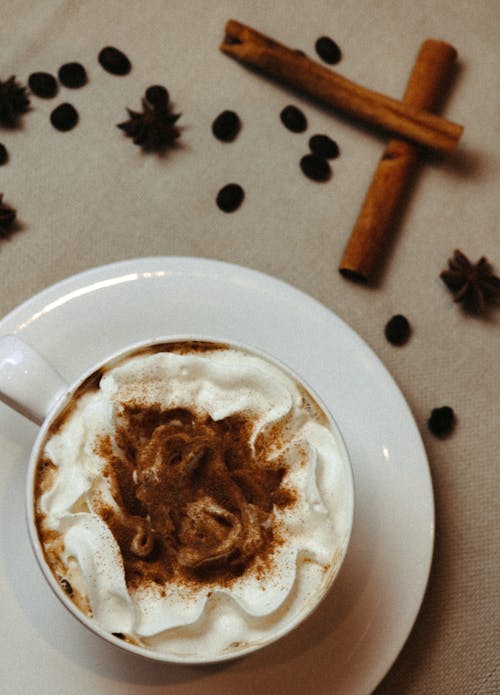 Cup of Coffee with Whipped Cream and Cinnamon 