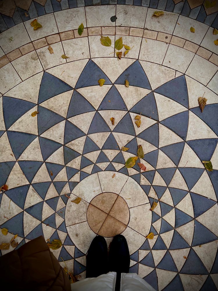 Person Standing On Mosaic Floor