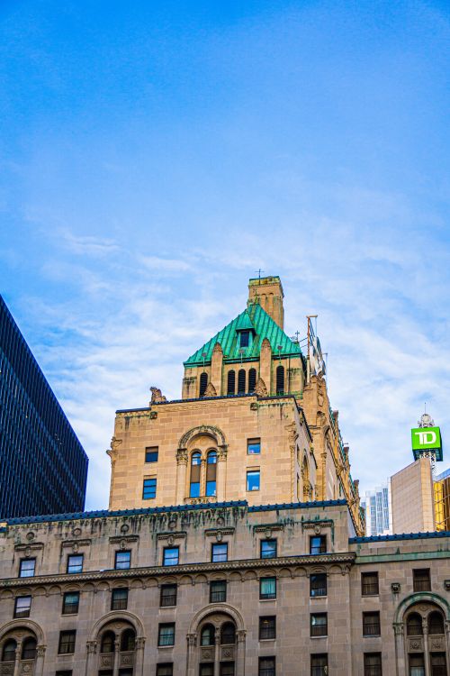 Free Low angle view of the historic Royal York Hotel in Toronto with a clear blue sky. Stock Photo