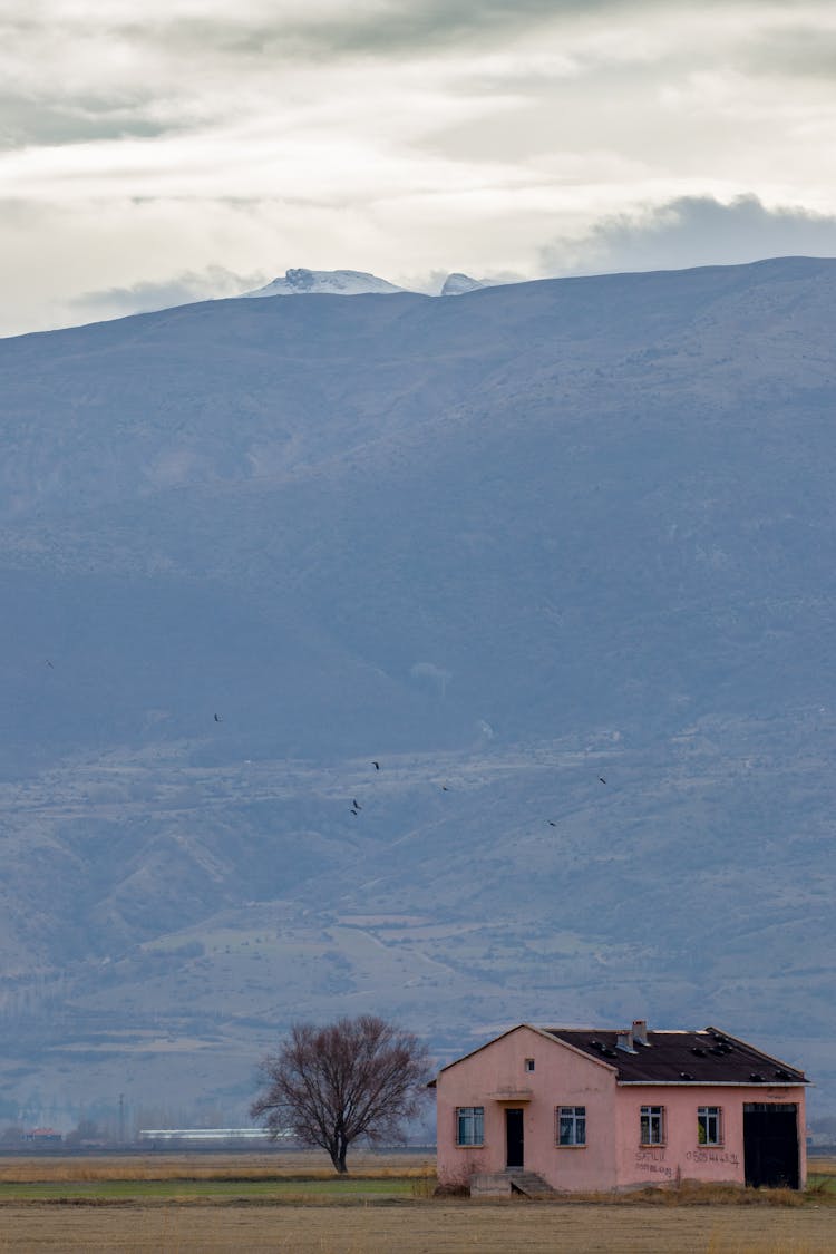 Abandoned House Near The Mountain