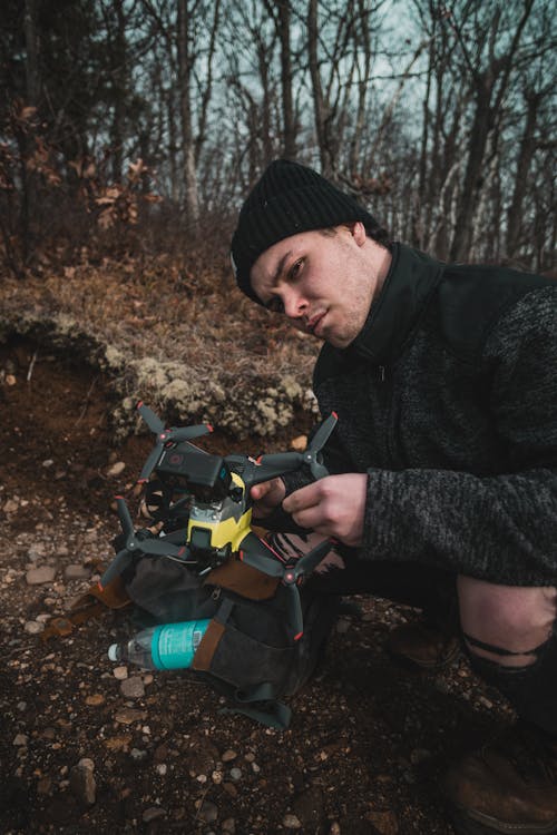 A Man Holding a Drone Camera