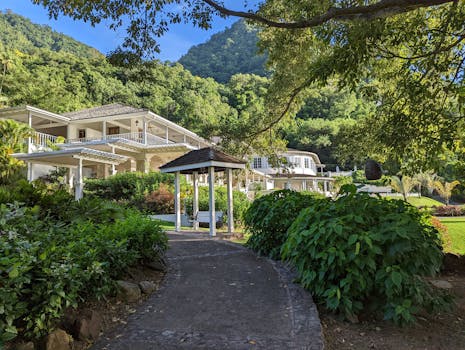 Idyllic resort setting with lush gardens and mountains, offering a serene escape.