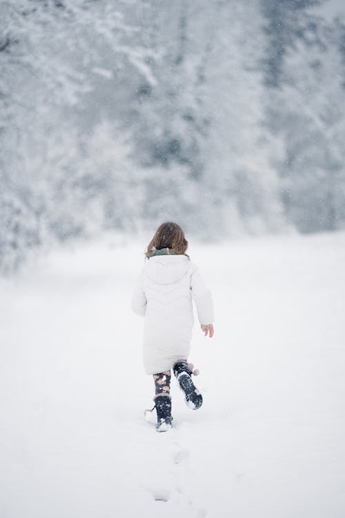 Girl Running on Snow · Free Stock Photo