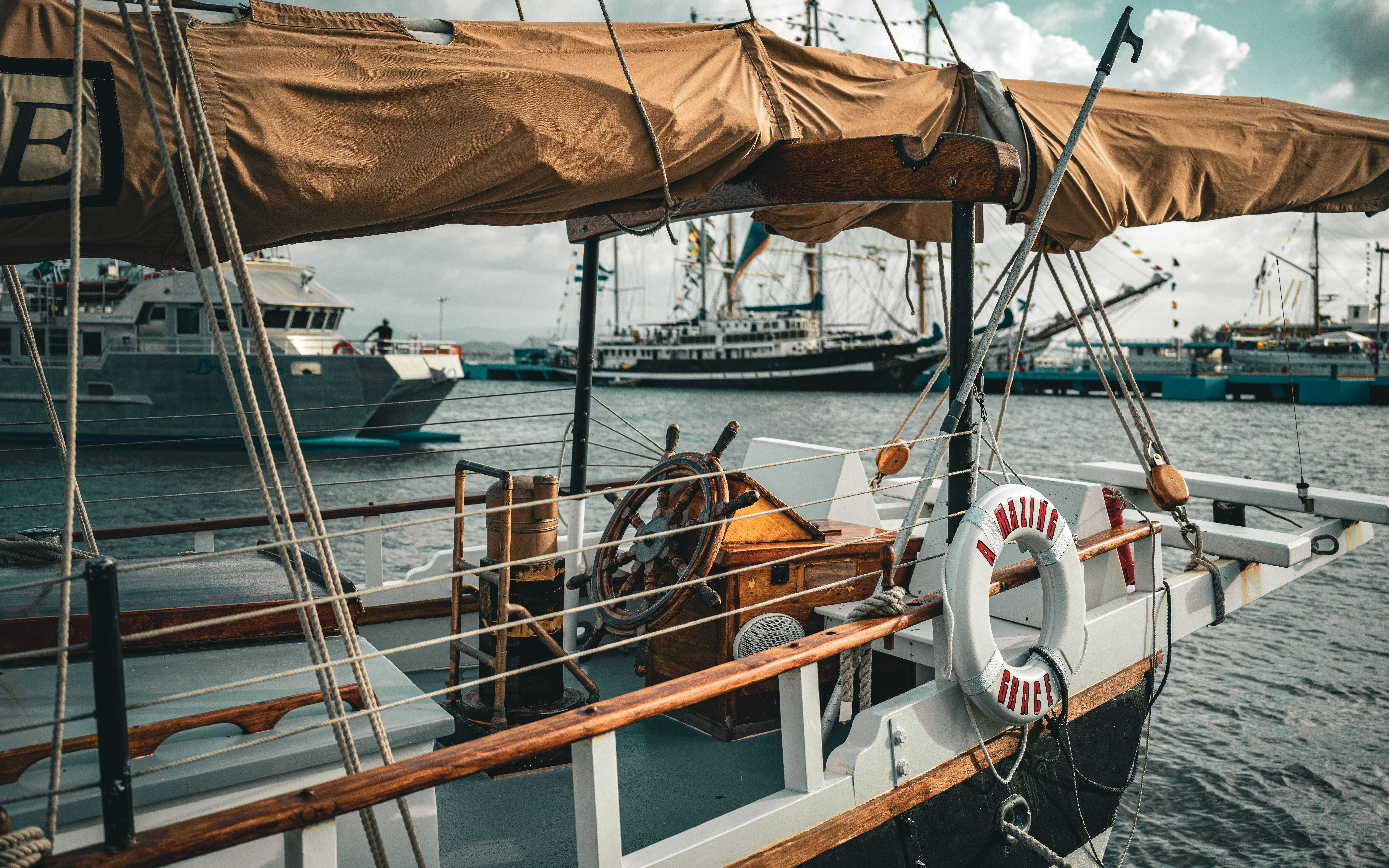 Best Aruba Sunset Jolly Pirate Sail with Open Bar Review: A Caribbean Adventure Worth Every Penny Review 2026 - A rustic sailboat docked in a bustling maritime harbor, showcasing nautical charm.