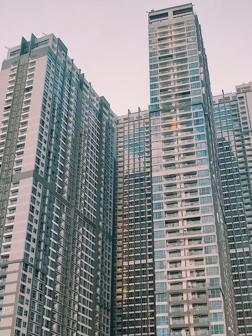 Free A vertical shot of modern skyscrapers forming a city skyline, depicting urban architecture. Stock Photo