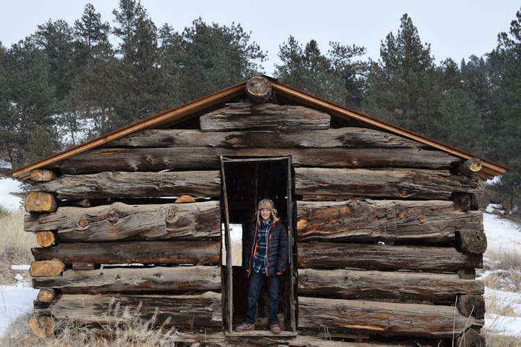 Person Standing In Front Of Barn House