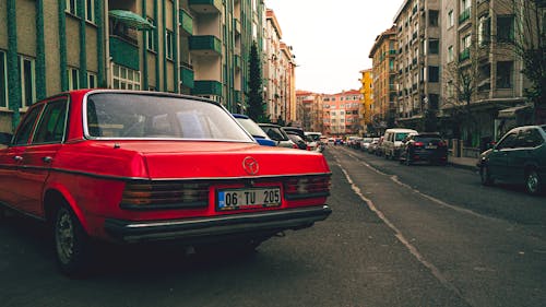 Back View of a Red Mercedes Parked on the Street