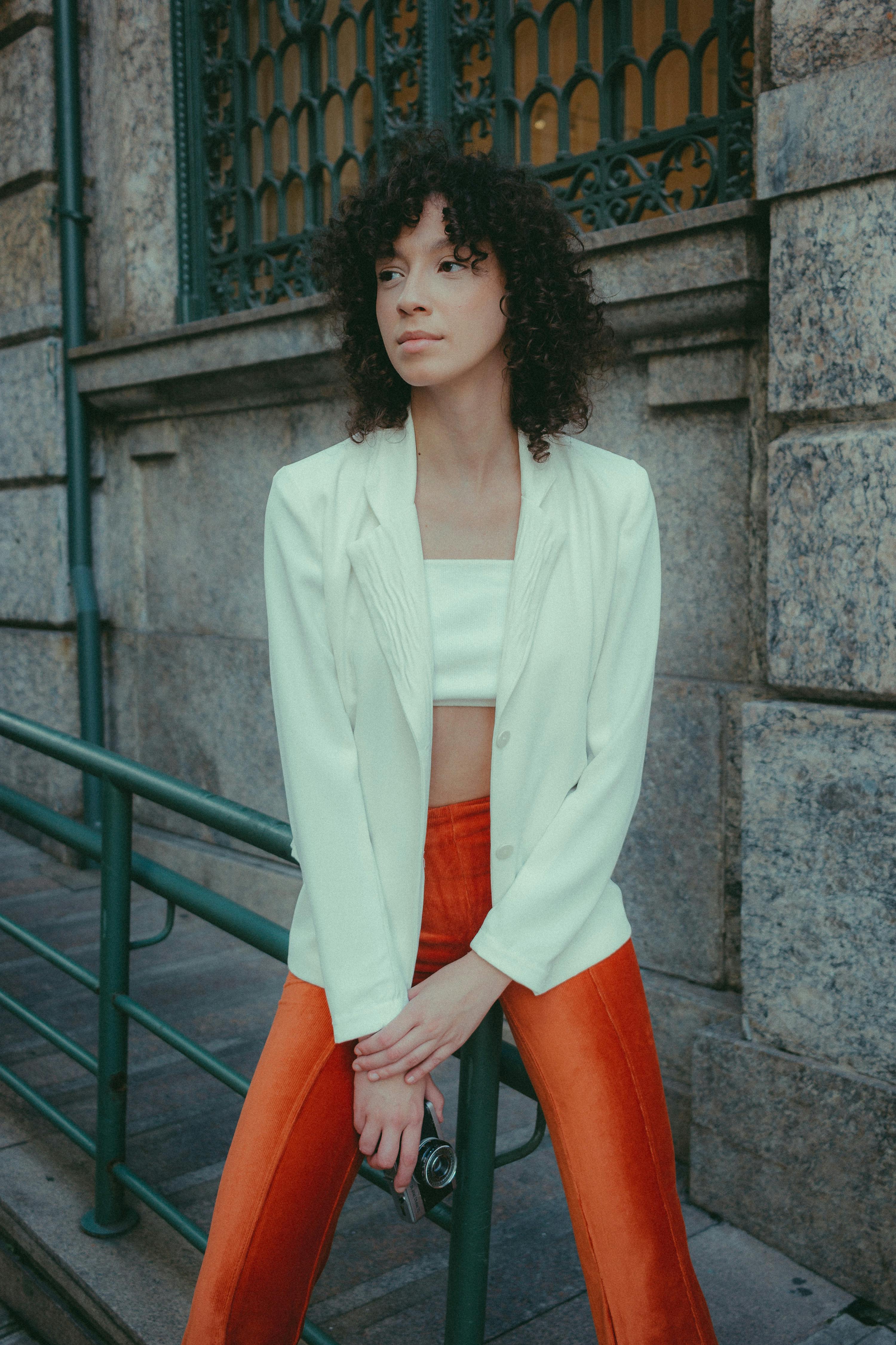 Fashionable woman in bright outfit on a Rio de Janeiro street. Chic urban style.