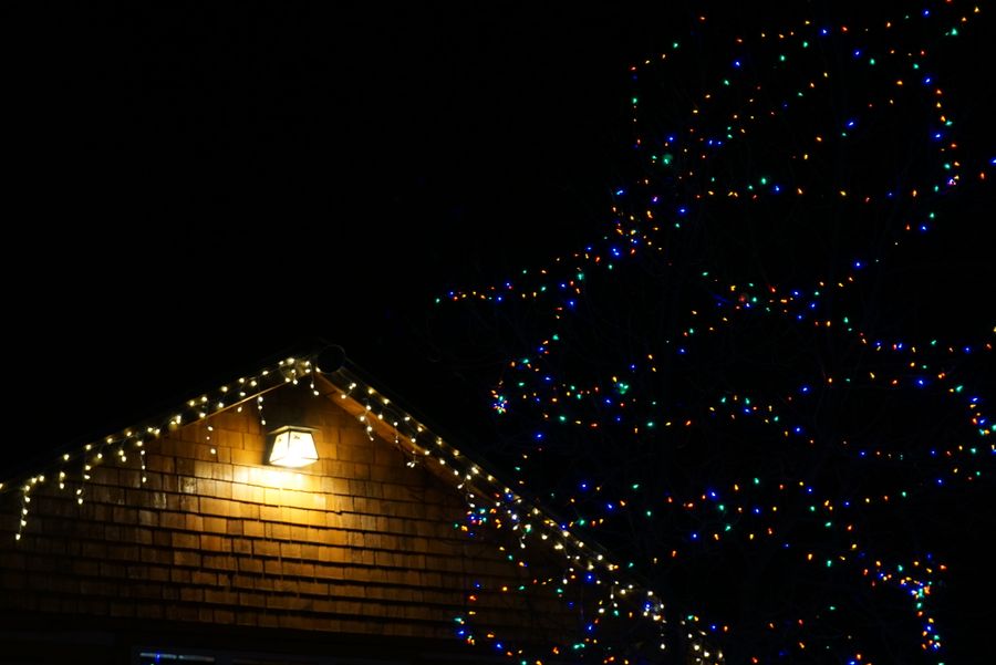 Holiday lighting inspiration with warm white lights outlining a house roof