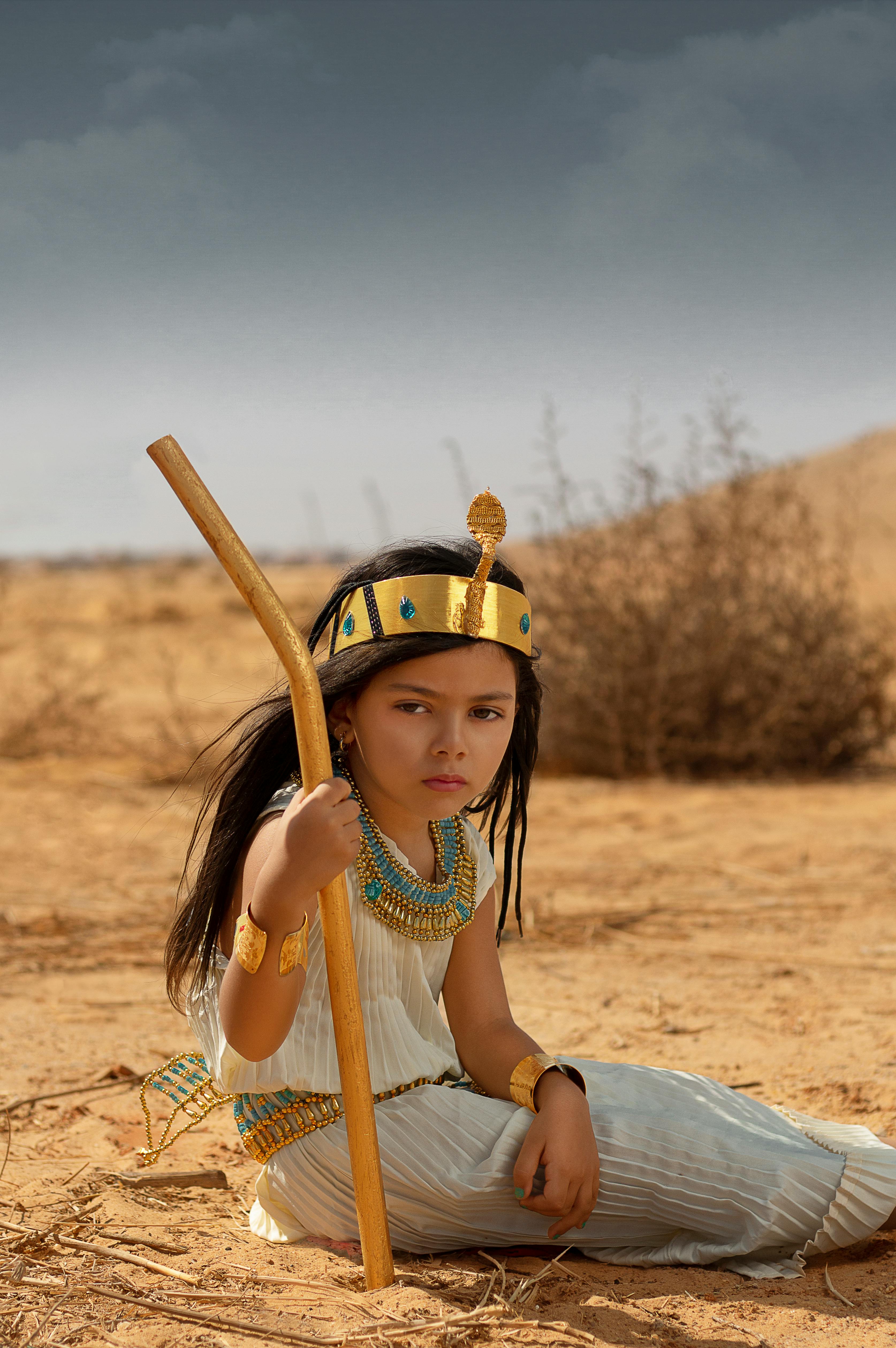 a little girl dressed as an egyptian princess