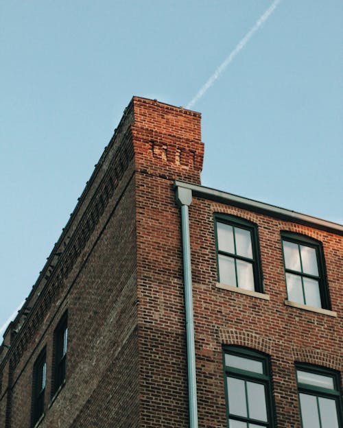 Brick Apartment Building against Blue Sky