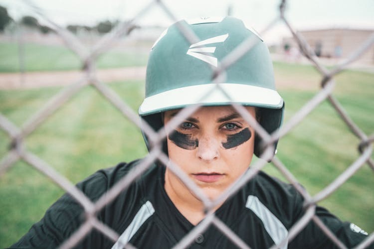 Woman Wearing Green And White Sports Helmet