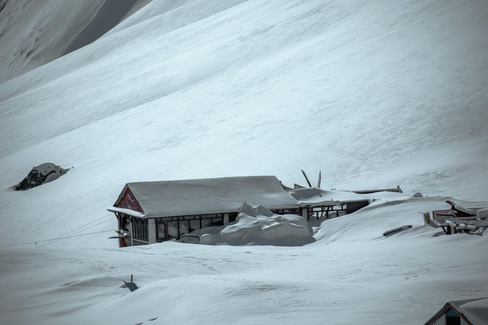 Broken Houses Covered with Thick Snow