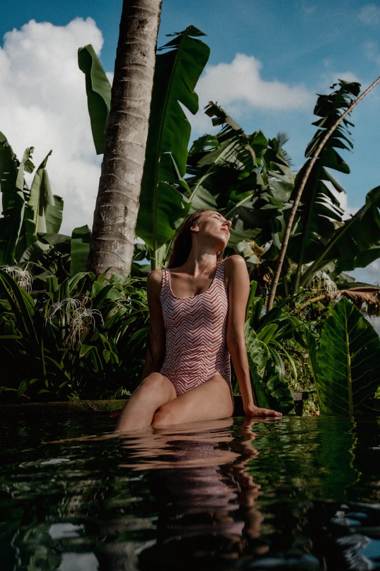 Woman Sitting In Water 