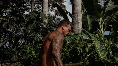 Shirtless Muscular Man in Jungle