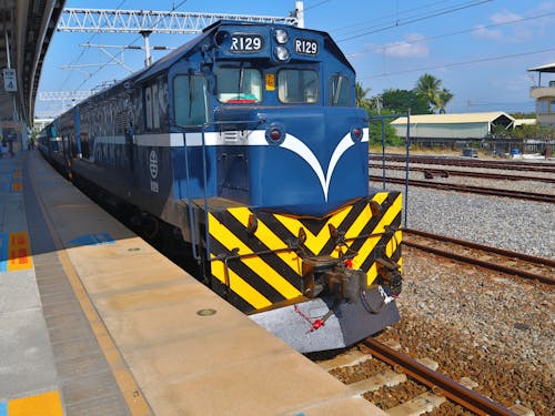 Free Blue Train Stopping on a Train Station Stock Photo