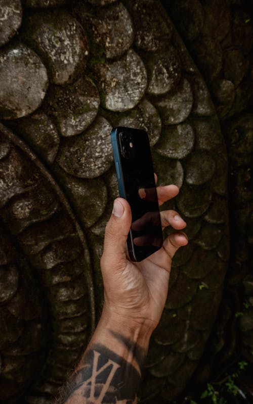 Close-Up Shot of a Person Holding a Cellphone